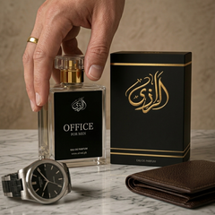Perfume bottle labeled 'Office for Men' with packaging, watch, and wallet on a marble surface.
